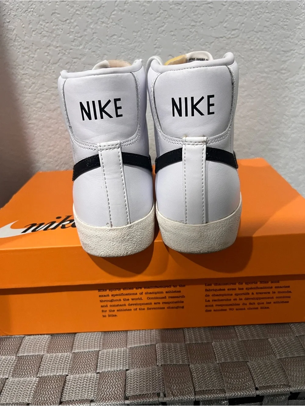 Nike White High-Top Sneakers with Black Swoosh